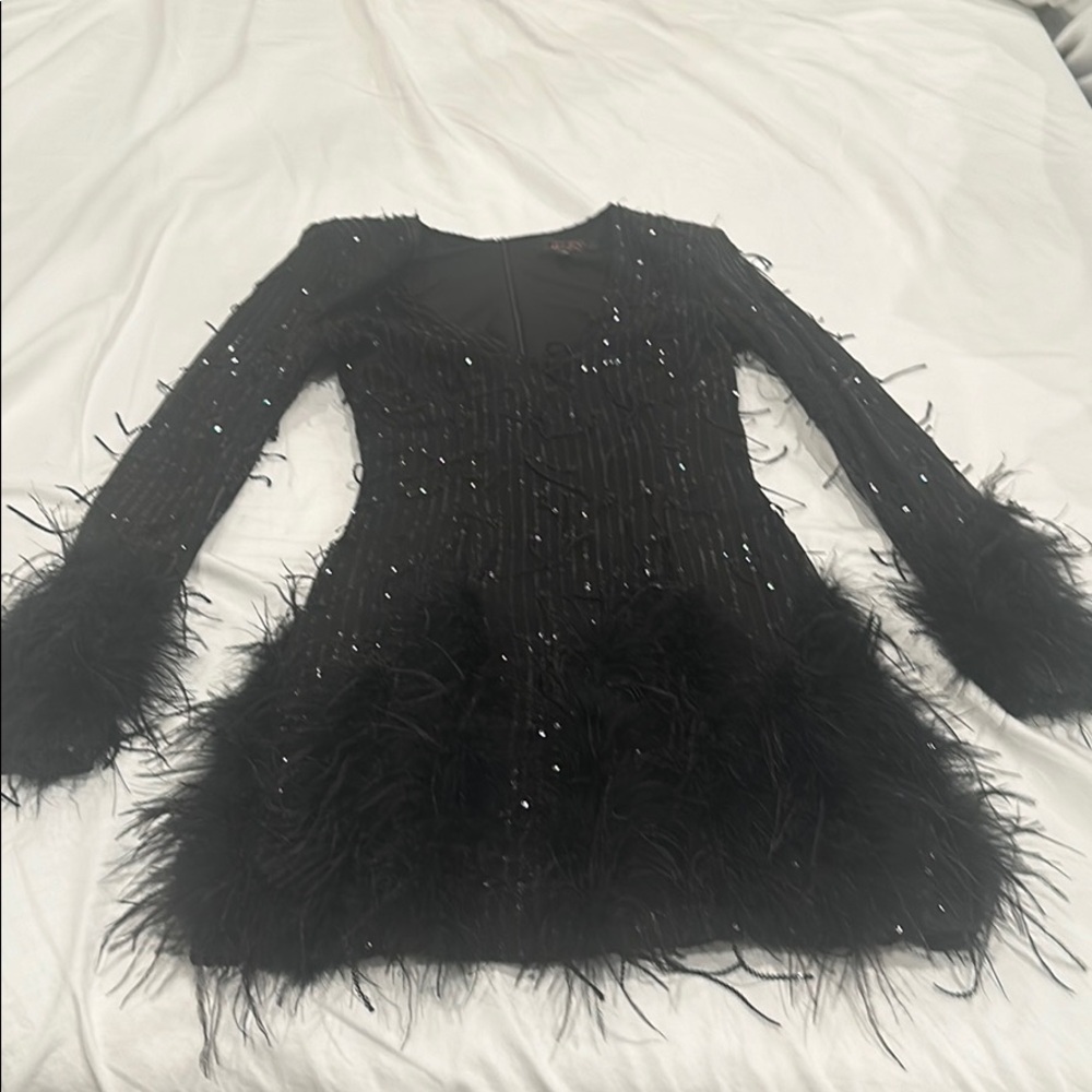 Black cocktail dress with feathers